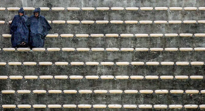 Two lone people in the stands