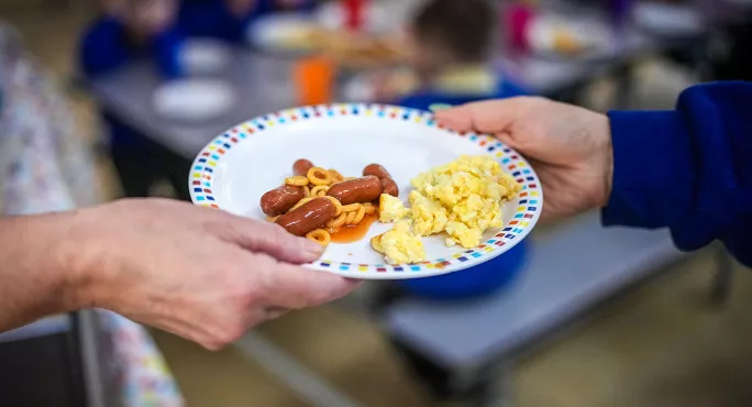 School child receiving breakfast