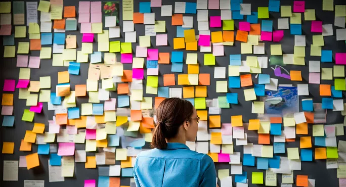 Teacher with lots of post-it notes