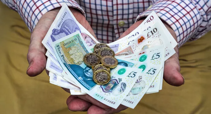 hands holding money