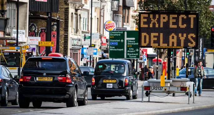 Traffic stopping at road sign