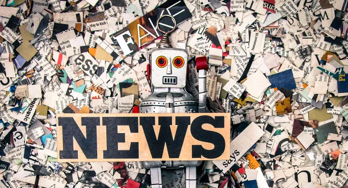 Fake news with ripped newspaper and robot
