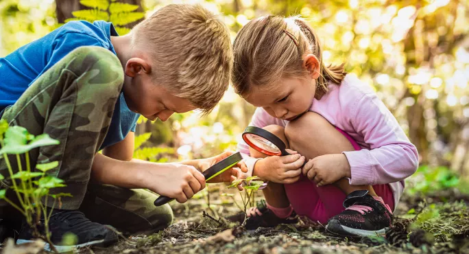 Two children learning about nature