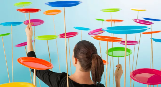 Woman spinning plates