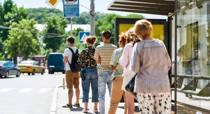 People waiting at a bus stop
