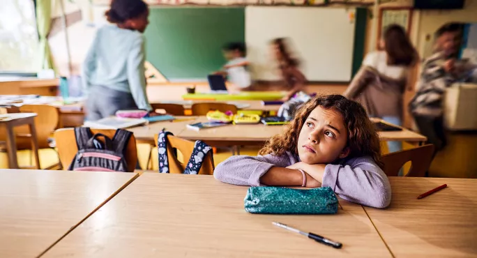 Pupil sitting on her own