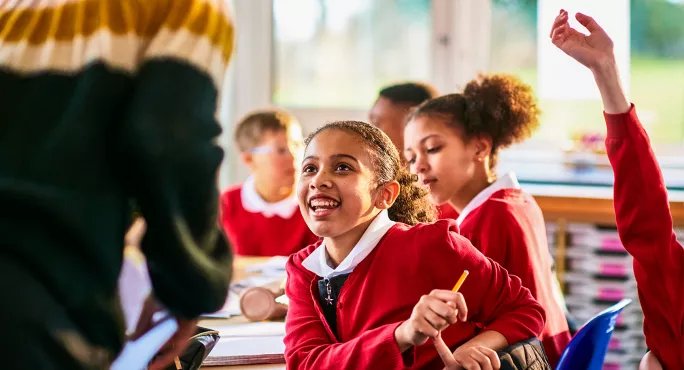Child excited talking to teacher