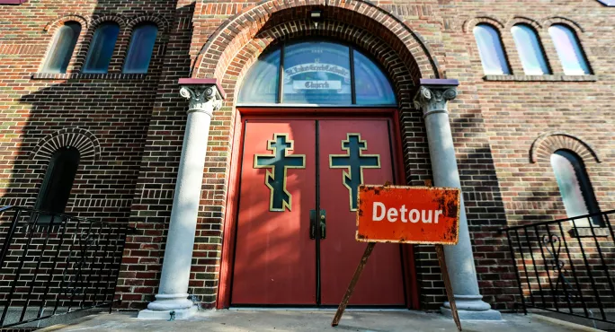 Church doors with detour sign