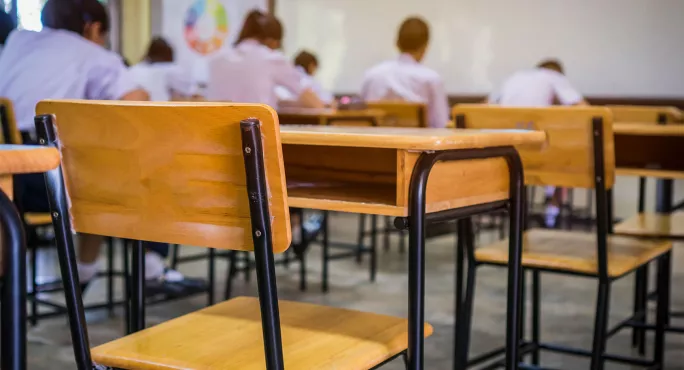 Empty chair in classroom