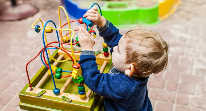 Small child playing a game