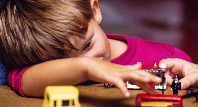 Small boy playing with toys