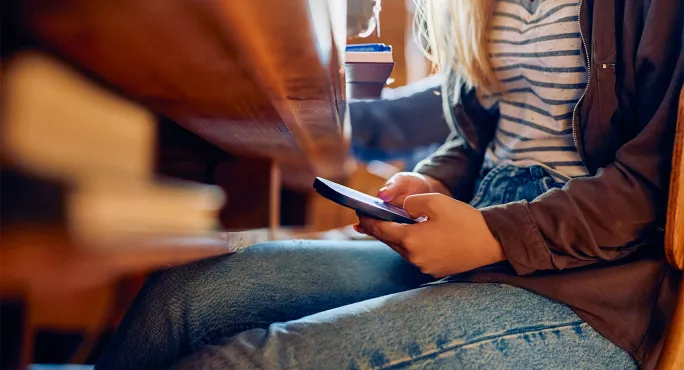 Girl looking at phone screen