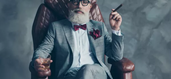 Besuited, Bearded, Bespectacled Man, In Armchair