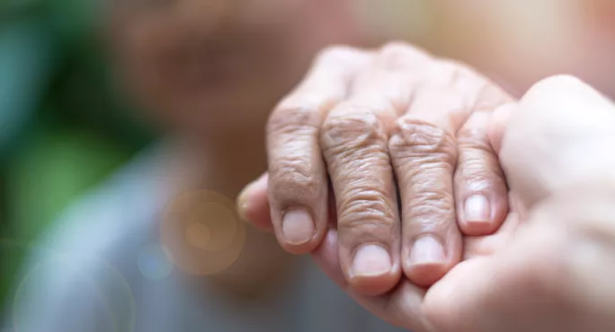 Holding Hands: A Young Hand & An Elderly Hand