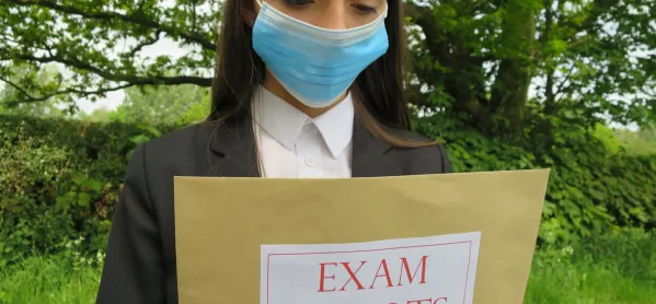 Girl In Face Mask Holds Envelope Labelled "exam Results"