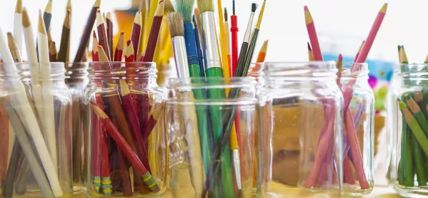 Different Colours Of Pencils & Pens In Separate Pots