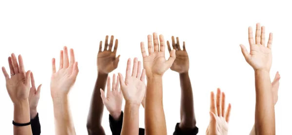 Several Different People's Hands, All Raised In The Air
