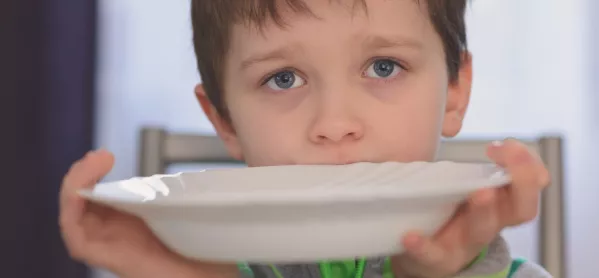 Hungry Boy Holds Up Empty Plate