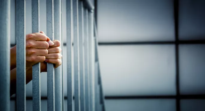 Prisoner, Holding On To Cell Bars