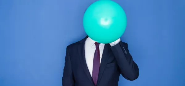 Man In Suit, With Inflating Balloon In Front Of His Head