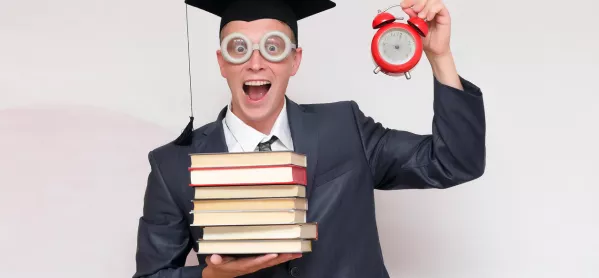 Teacher In Mortar Board Carries Pile Of Books & Holds Up Alarm Clock