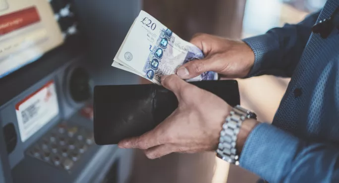 Woman Withdrawing Money From Cashpoint