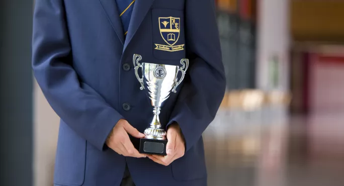 Private School Pupil With Cup