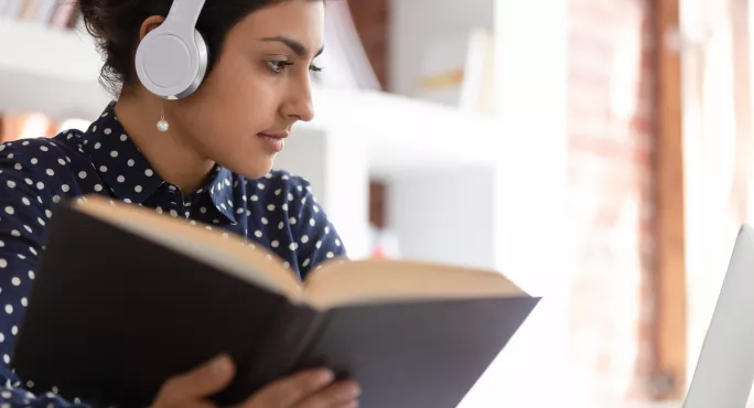 A Student Listens To Music Paired With A Literary Text