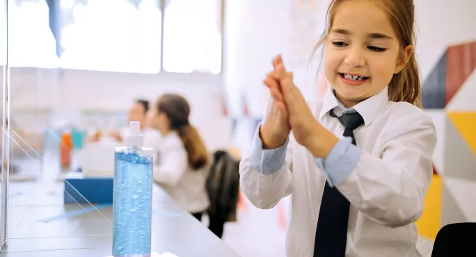 Schoolgirl Uses Hand Sanitiser Before Lunch