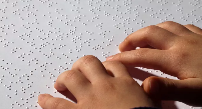 Girl Reading Braille