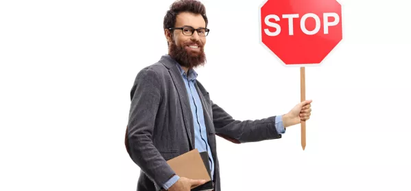 Teacher, Holding Books & A "stop" Traffic Sign