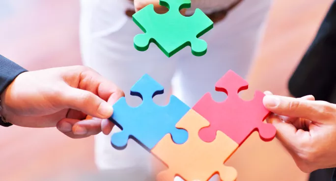 Four Pieces Of A Jigsaw Puzzle, Being Joined Together