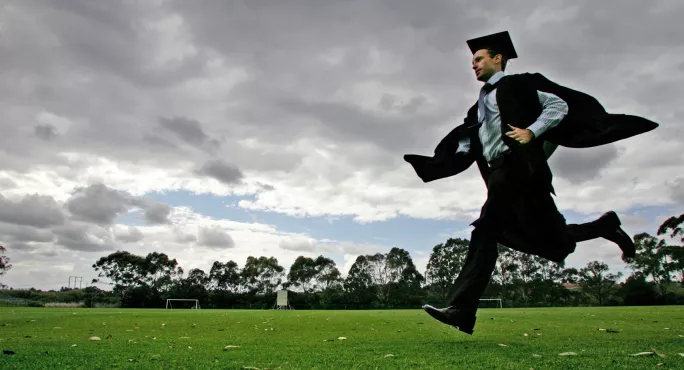 Student With Mortar Board Running