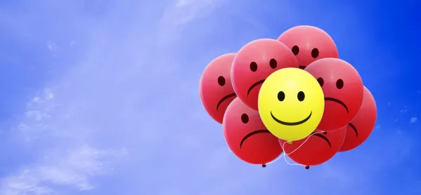 Multiple Balloons With Sad Faces, Hiding Behind A Single Happy-face Balloon