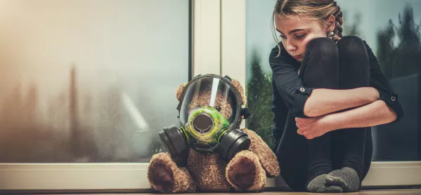 Sad Girl Sits Next To Teddy Bear In Gas Mask