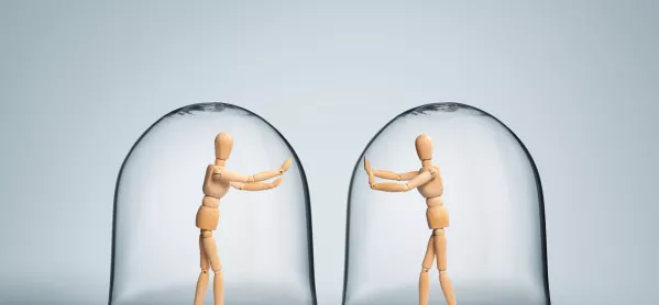Two Wooden Figures, Enclosed By Separate Bubbles, Try To Touch On Another