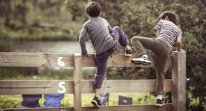 Primary Maths: Two Boys Taking Shortcut Across Field