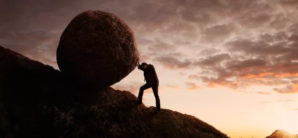 Man Pushing Boulder Up A Hill