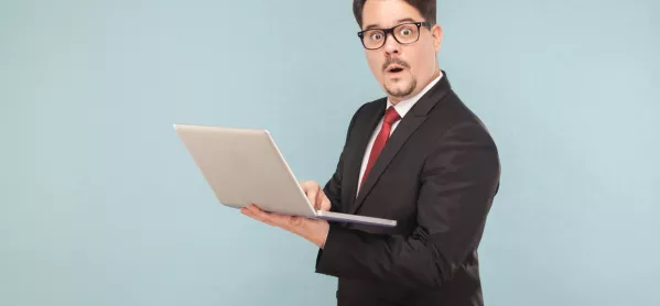 Man In Suit, Holding Laptop, Looking Surprised