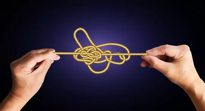 Tangled Knot, With Hands Pulling At It