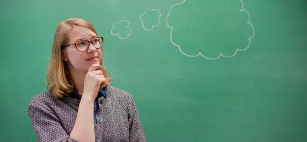 Teacher Stands By Blackboard, With Thought Bubble Emerging From Her Head