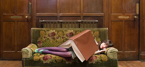 Woman, Sleeping On Sofa Under Giant Book
