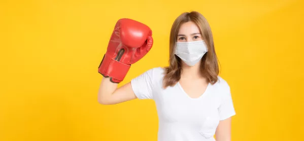 Woman, Wearing Face Mask & Oversized Boxing Glove