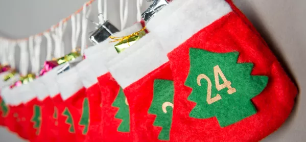 Advent Calendar, Made Up Of A Series Of Present-filled Stockings, Strung Up In A Row