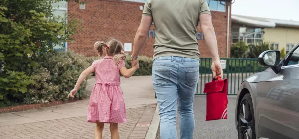 A Father Walks His Primary-aged Daughter To School