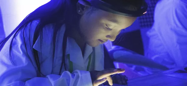 Girl Wearing An Eeg Headset & Using A Tablet