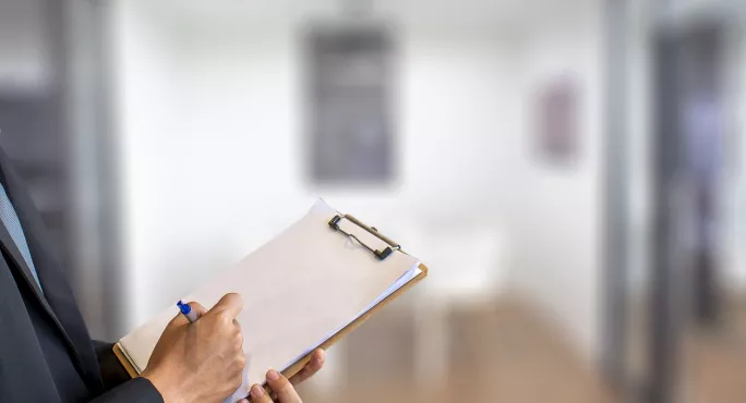 Inspector Holding A Clipboard