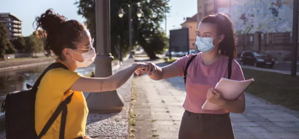 Two Girls Fist Bump Pandemic