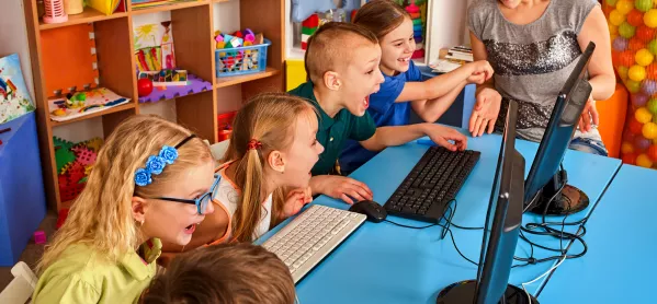 Children Playing Computer Games In Classroom