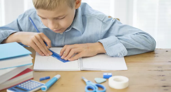 Student Measuring In Exercise Book